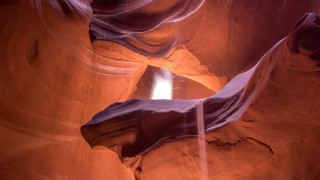 Antelope canyon lit by sunbeams