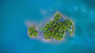 Drone picture of a small, green island